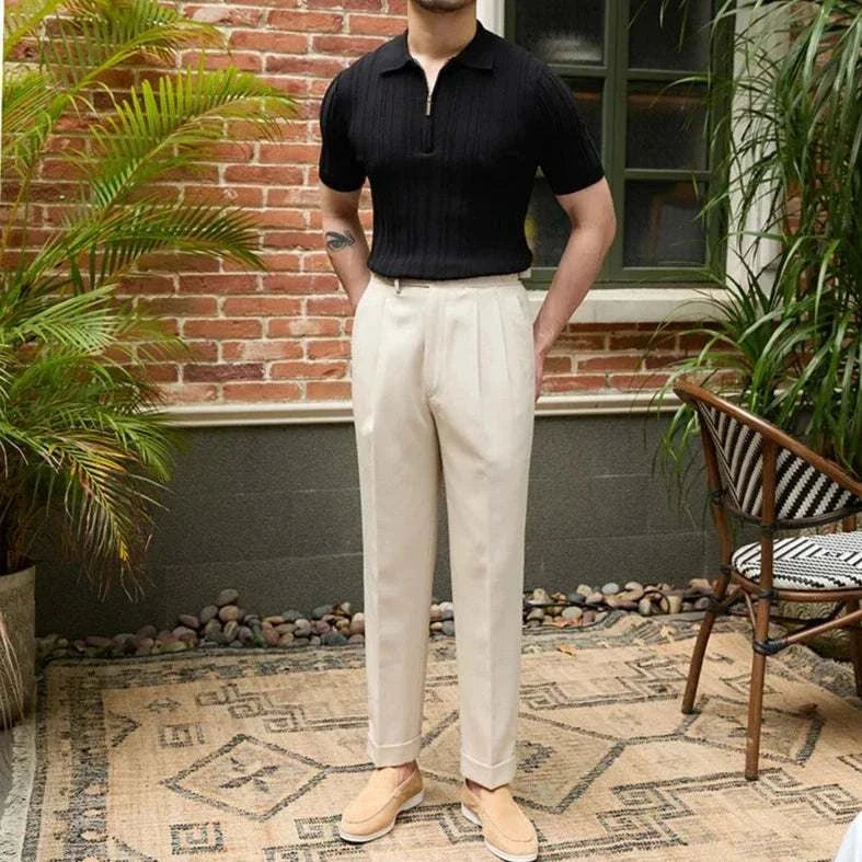 Spring zipper t-shirt men in black with short sleeves, paired with beige pants.