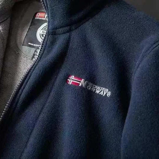 Norway puffer jacket in navy with embroidered flag detail.