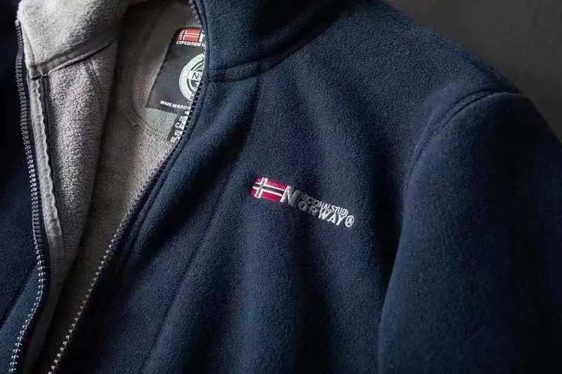 Norway puffer jacket in navy with embroidered flag detail.