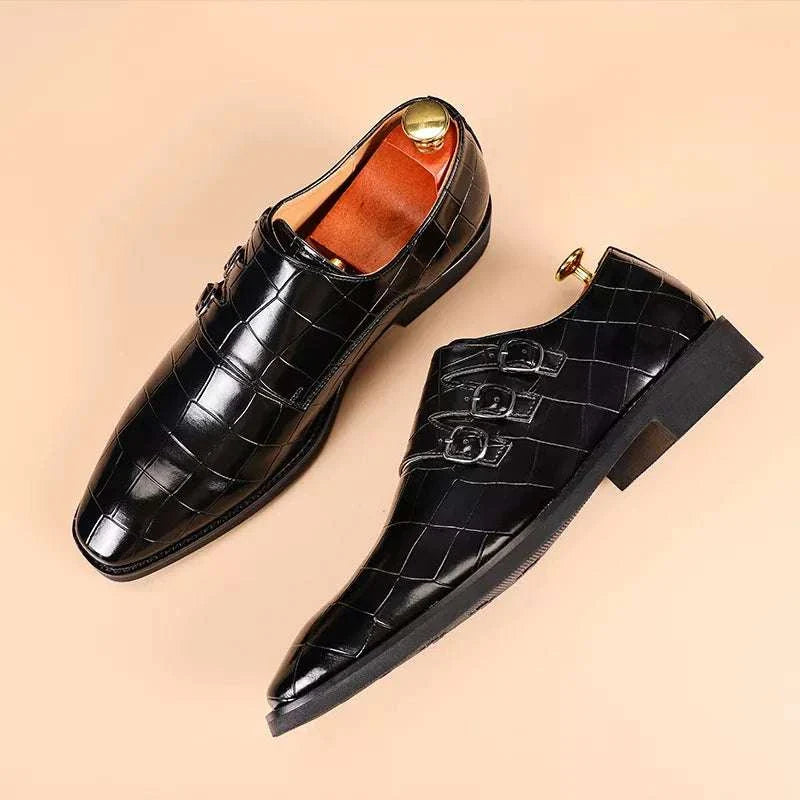 Elegant black Oxford triple strip-on shoes with intricate perforations and cushioned insole for men.