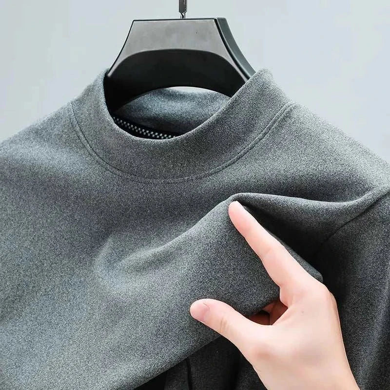 Classic gray turtleneck sweater on hanger, close-up view of fabric texture.