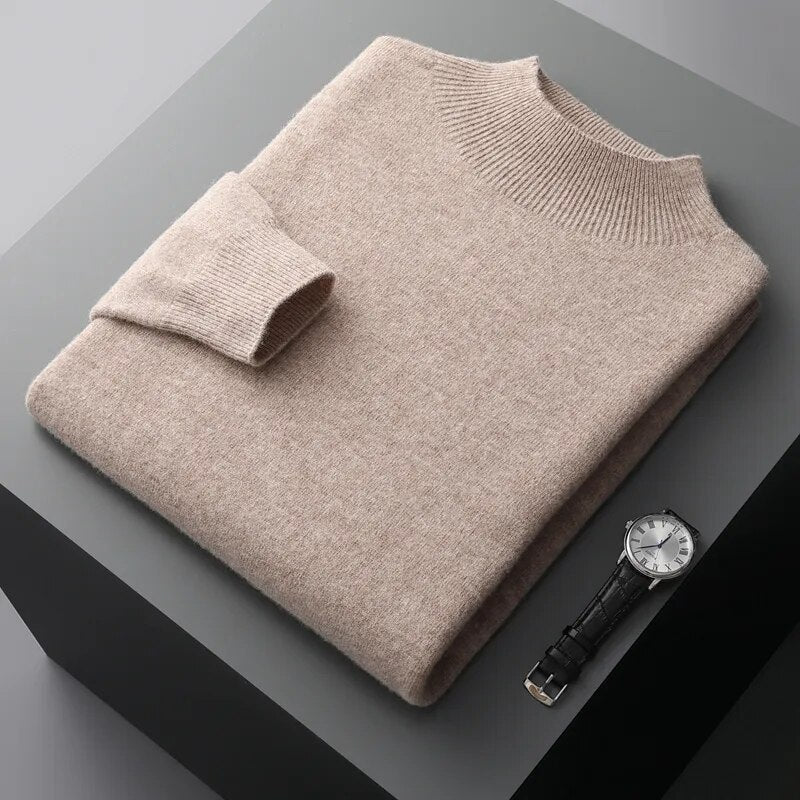 Antonios Pure Wool Sweater in beige, folded neatly with a watch beside it, showcasing premium quality material and casual elegance.