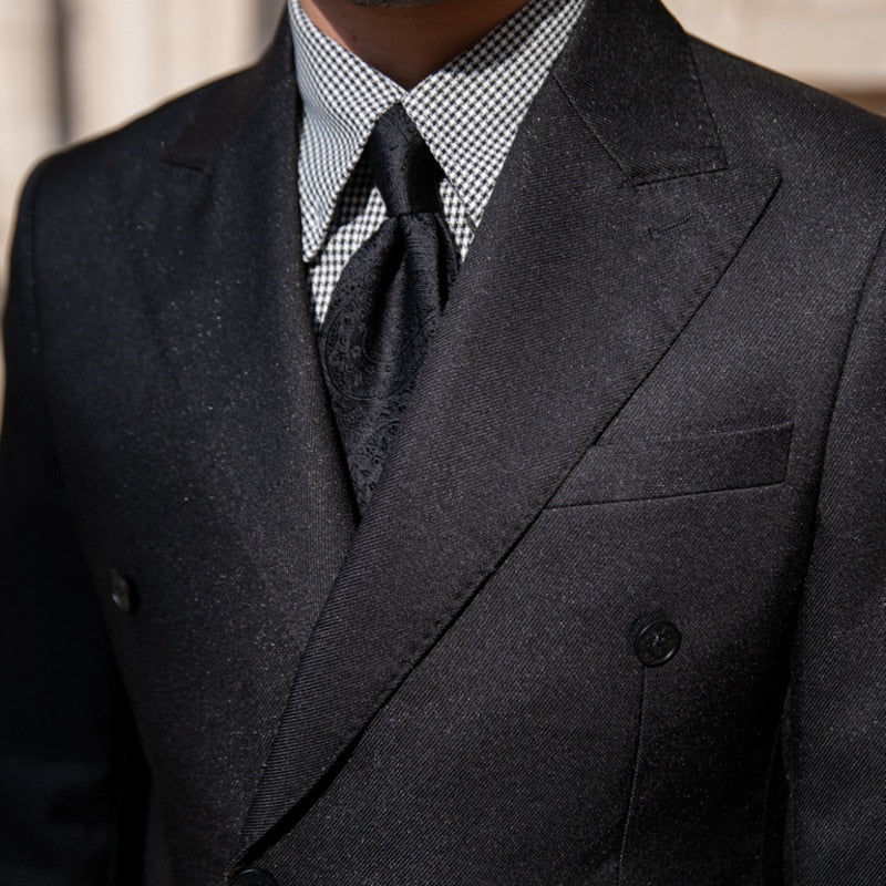 Antonios Double Breast Suit in black, featuring a solid pattern and chic design for men.