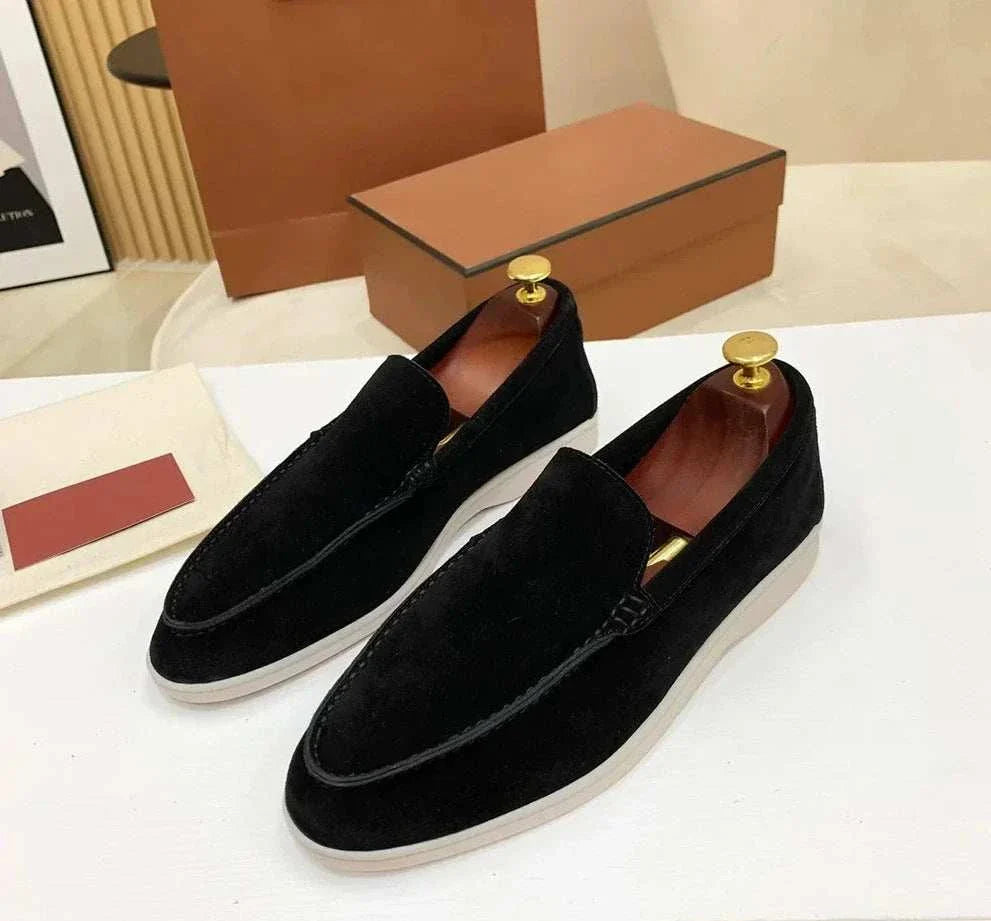 Suede genuine leather elegant loafers with rubber outsole on display.
