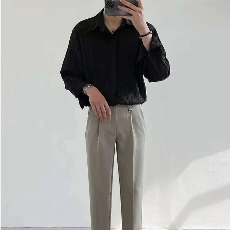 Men's Korean design loose shirt in black, ideal for spring and summer, offering comfort and style.