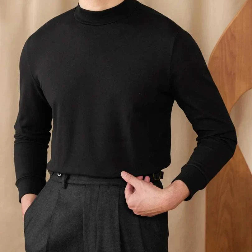 Soft black half turtleneck sweater for men made of polyester, showcasing comfort and style.