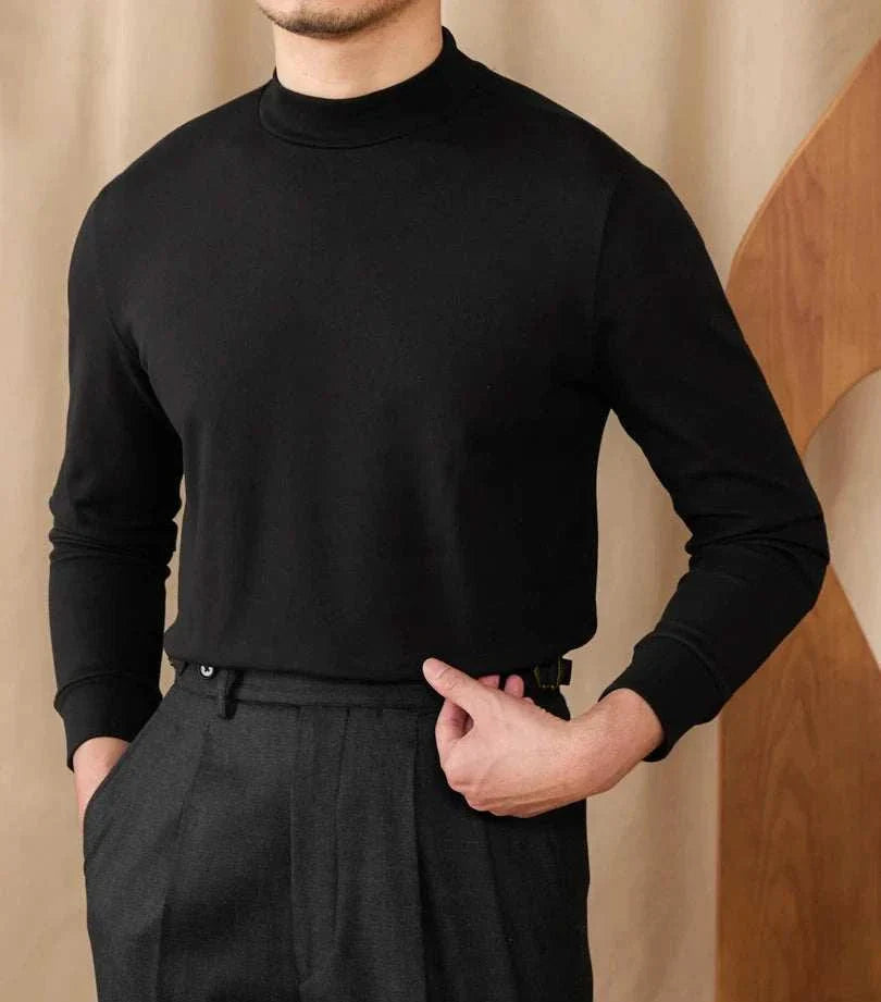Soft black half turtleneck sweater for men made of polyester, showcasing comfort and style.