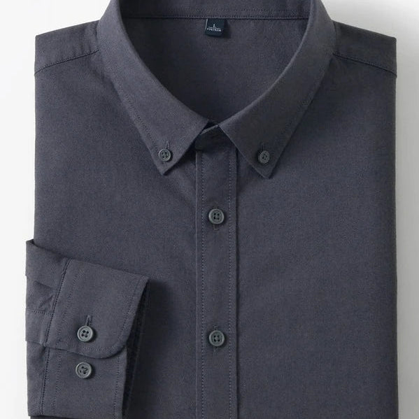 A folded dark gray long-sleeve button-down shirt with a pointed collar and matching buttons, shown on a light gray background with two small inset detail images on the right.