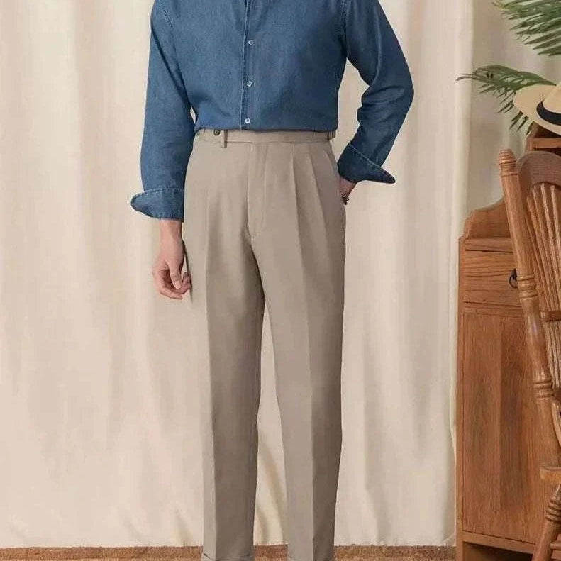 Vintage casual long sleeve shirt for men in solid blue with beige trousers; elegant and breathable cotton blend.