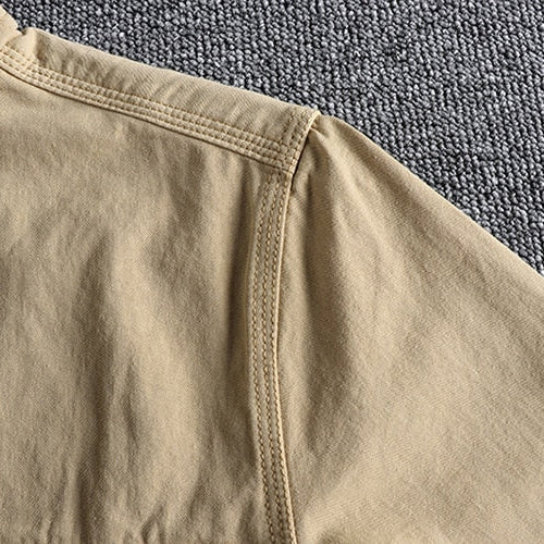 Close-up of the Vintage-Retro Cotton Shirt fabric in beige color, highlighting the quality stitching and cotton-linen blend material.
