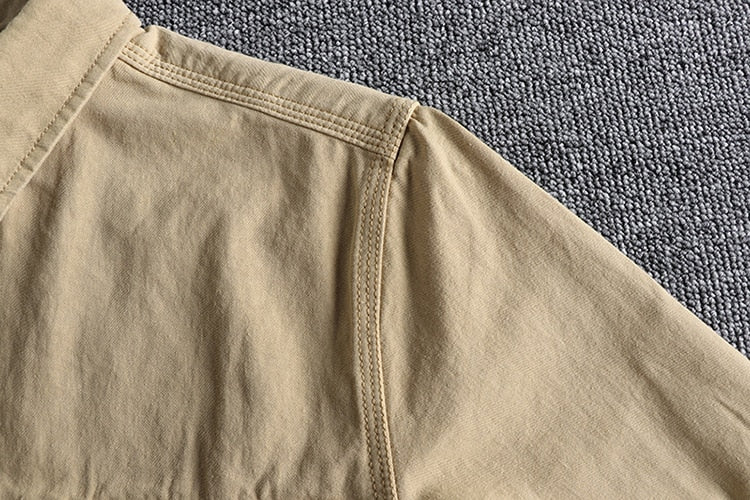 Close-up of the Vintage-Retro Cotton Shirt fabric in beige color, highlighting the quality stitching and cotton-linen blend material.