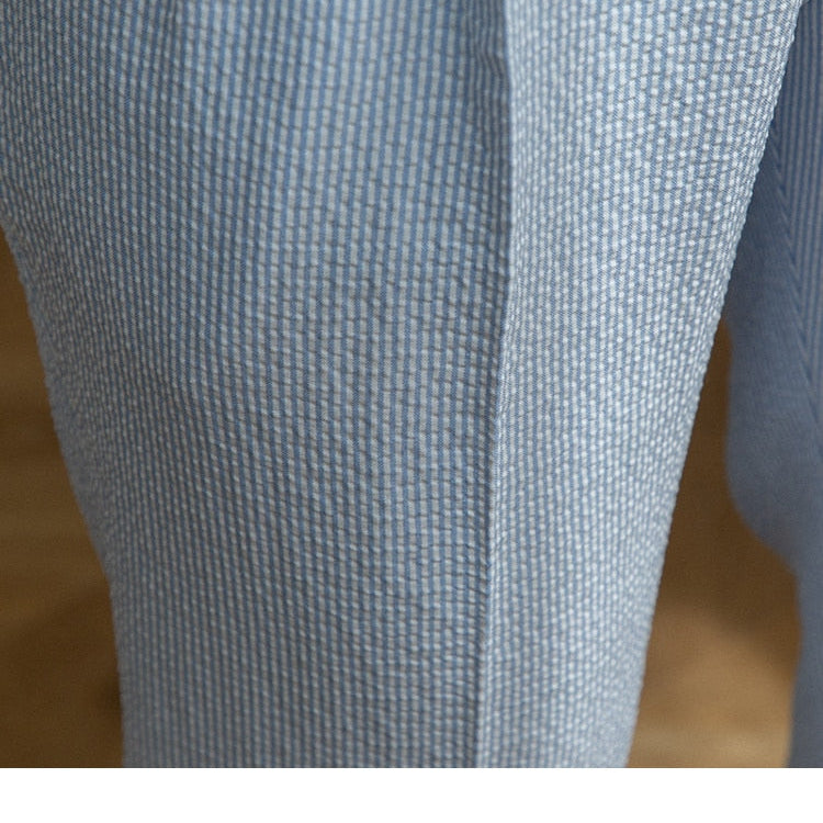 Close-up of Italian Old Money Trousers showing blue fabric texture.