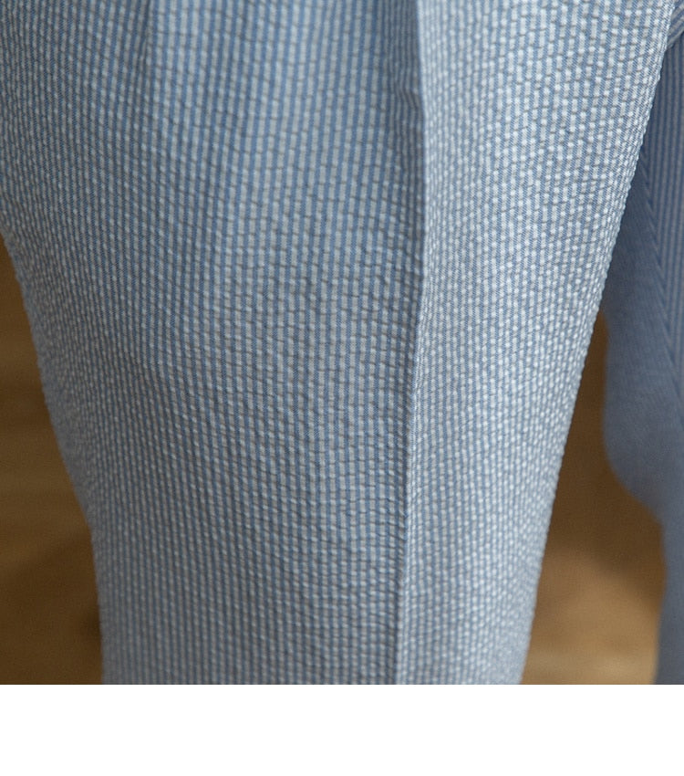 Close-up of Italian Old Money Trousers showing blue fabric texture.
