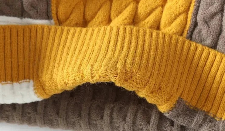 Brown and yellow Norway neck sweater fabric detail, showcasing cable knit and ribbed textures.