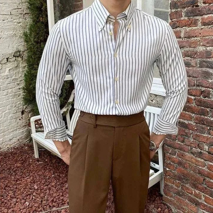 Antonios British retro striped shirt with classic collar, worn with brown pants.