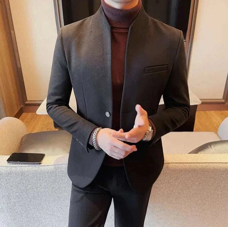 Formal blazer with round collar, elegant design in dark fabric.