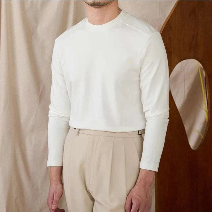 Slim fit smart casual premium sweater in white, worn by a man.