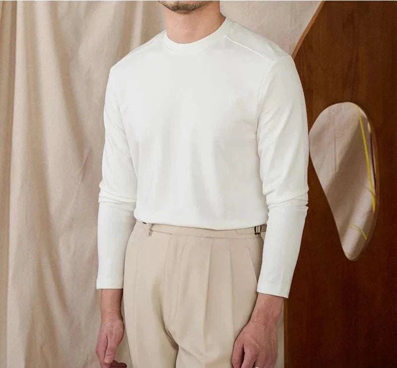 Slim fit smart casual premium sweater in white, worn by a man.