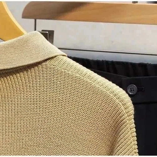 Beige half zipper sweater by Antonio on hanger showing knit texture.