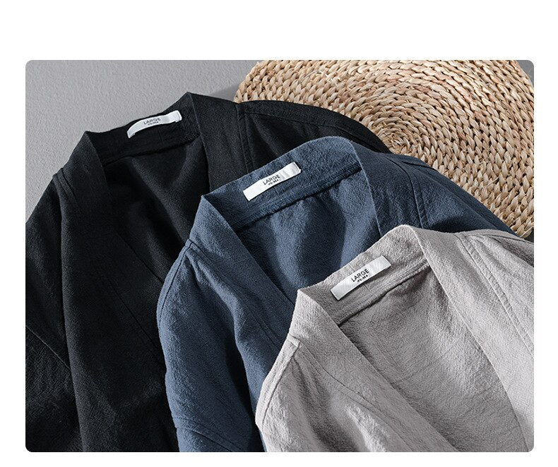 Three Antonios Linen Long-Sleeved Shirts in black, blue, and grey displayed on a woven mat, showcasing elegant design and premium linen-cotton blend.