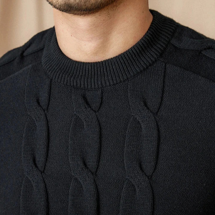 Round neck vintage sweater in black with cable knit design.