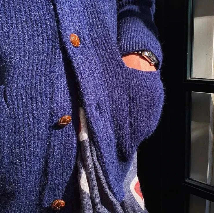 Oxford premium cardigan in navy, cozy knit with buttons, worn casually.