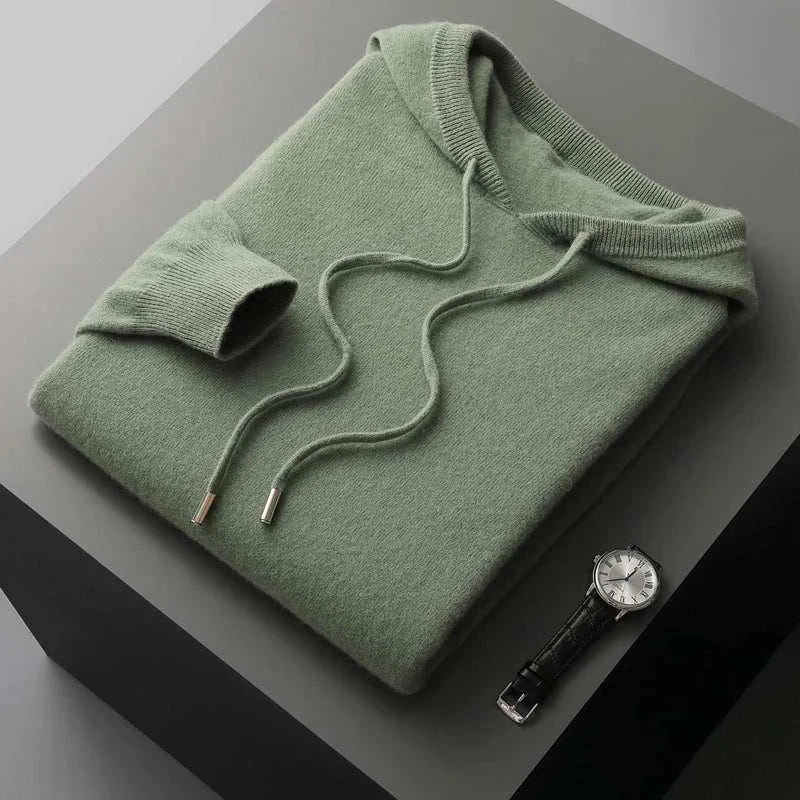 Wool cold season sweater, folded and displayed with a watch.