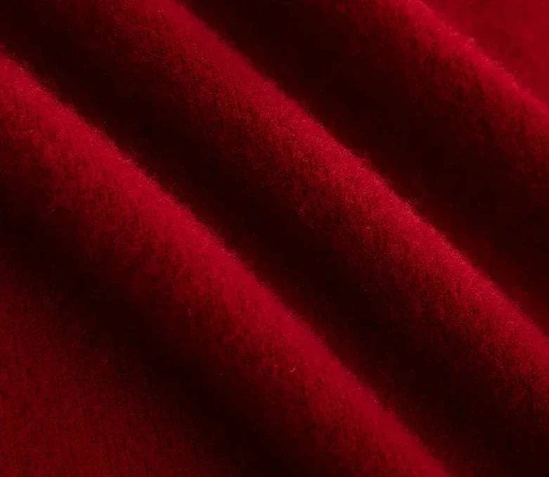 Close-up texture of red wool fabric for business wool turtleneck sweater.