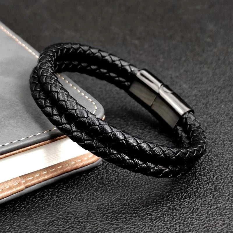 Double band leather bracelet with stainless steel clasp on book.