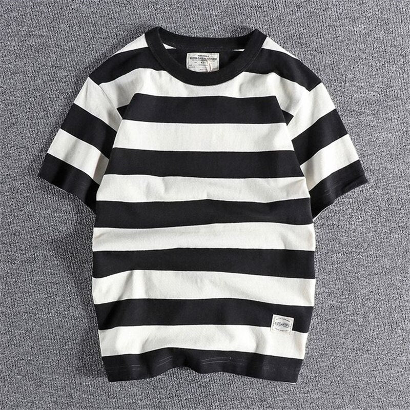 Summer Striped T-Shirt with black and white horizontal stripes on a flat surface.