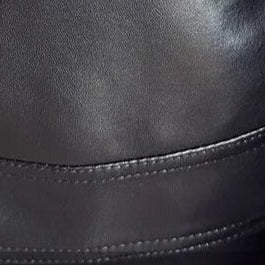 MOTO black leather jacket made from eco-leather, close-up view.