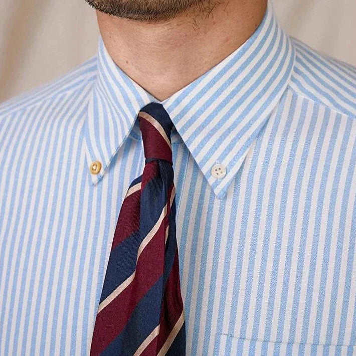 Oxford style striped cotton shirt with a button-down collar and tie.