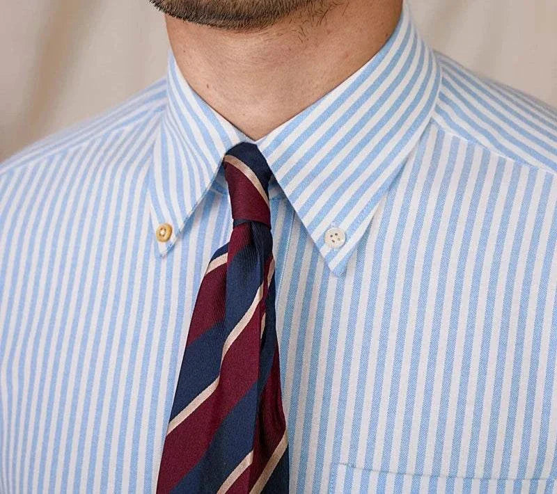 Oxford style striped cotton shirt with a button-down collar and tie.