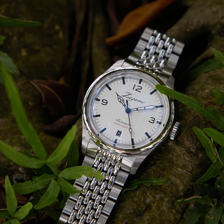 Automatic waterproof vintage watch with stainless steel band and case, displayed outdoors.