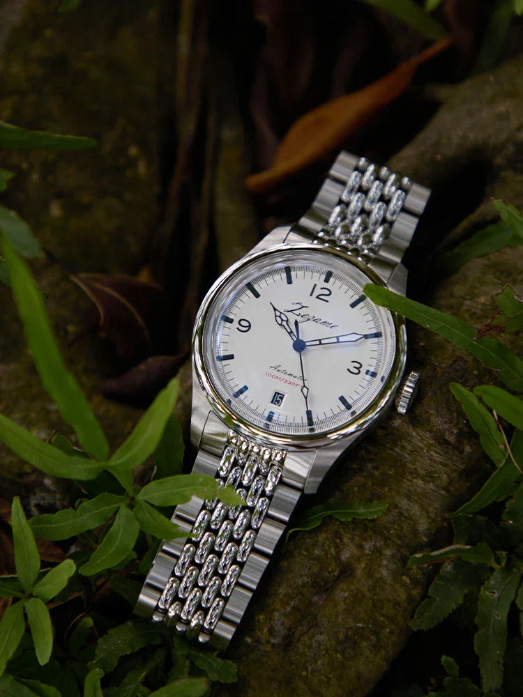Automatic waterproof vintage watch with stainless steel band and case, displayed outdoors.