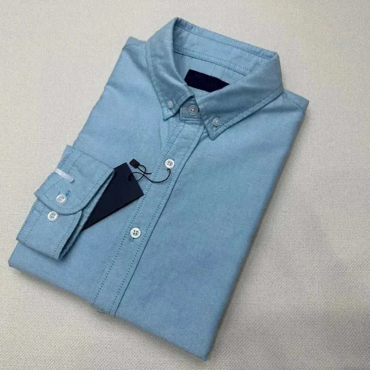 Oxford business casual long sleeve cotton shirt folded neatly.