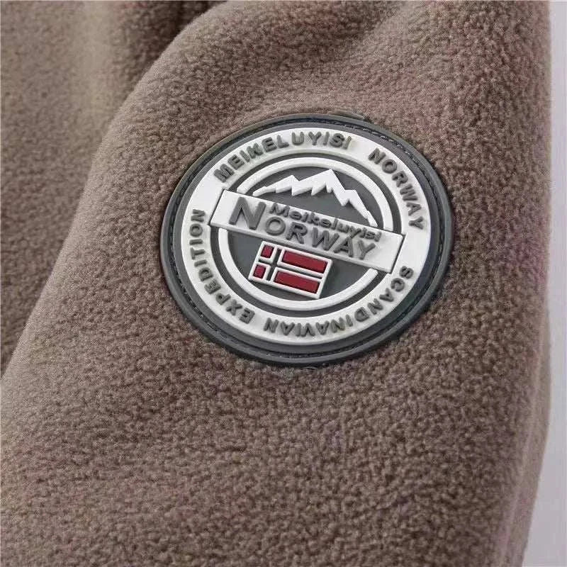 Norway velvet jacket badge detail with mountain and flag design.