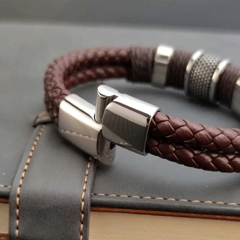 Genuine leather double bracelet with stainless steel clasp and PU detailing.