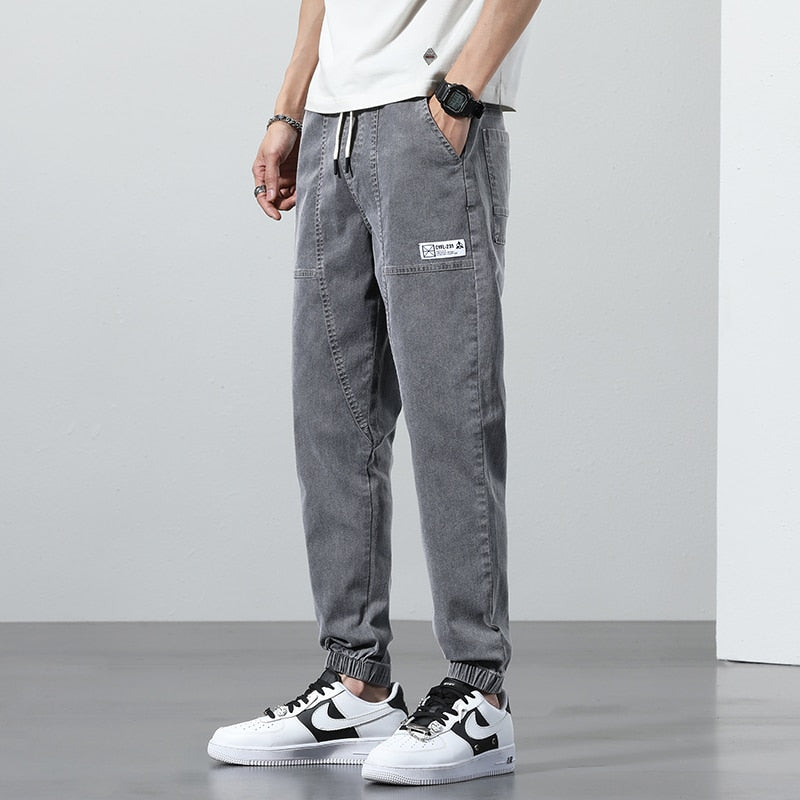Men's grey relaxed fit denim joggers for casual occasions.