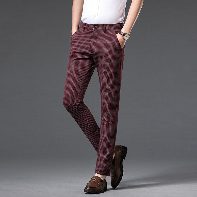 Man wearing Vinny Plaid Trousers in wine red for formal and casual occasions.