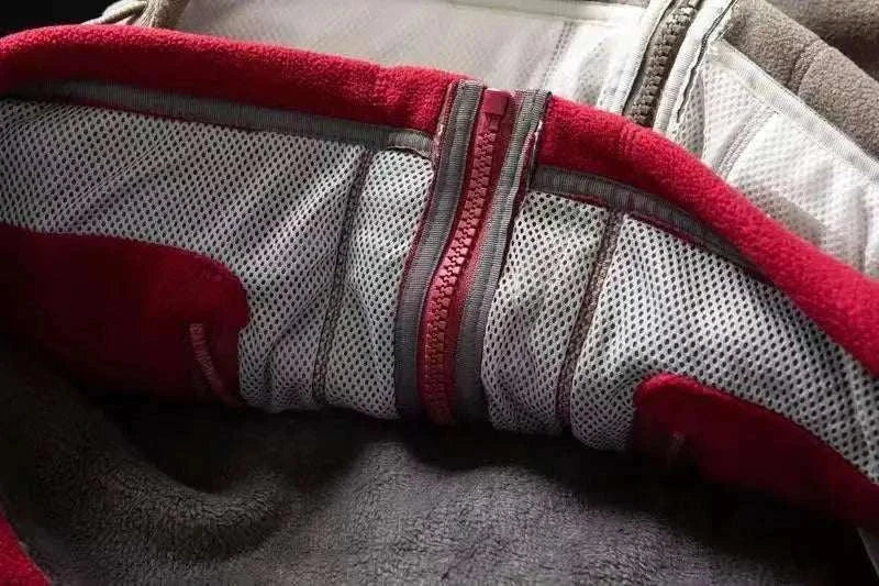 Inner lining of Norway puffer jacket showing red and gray colors.