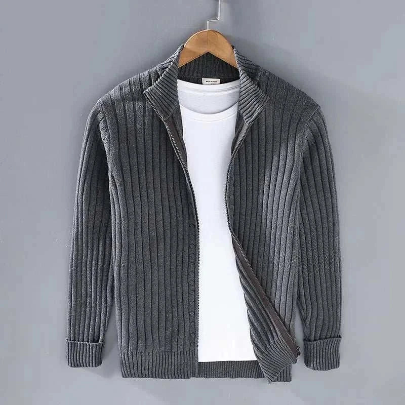Men's ribbed gray stand collar cotton cardigan over white shirt.