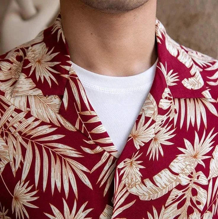 Vintage Hawaiian flower shirt with red and beige floral pattern, casual men's style.