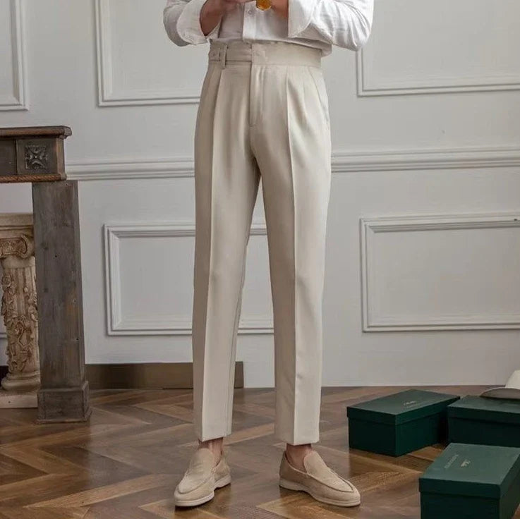 Antonios draped suit pants in a stylish, Korean-inspired design on a wooden floor setting.