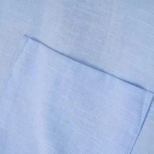 Close-up view of Antonios cotton-linen long sleeve shirt fabric in light blue.