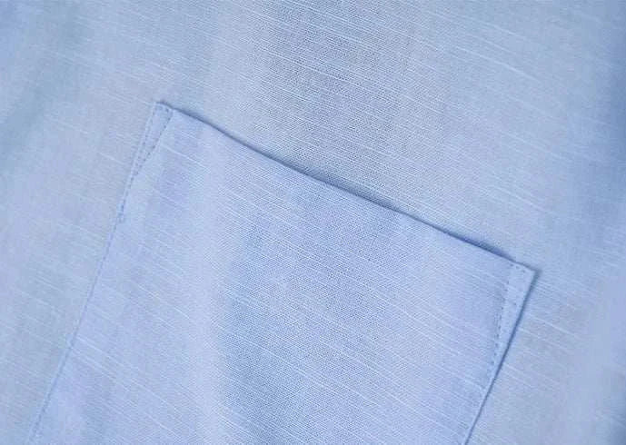Close-up view of Antonios cotton-linen long sleeve shirt fabric in light blue.