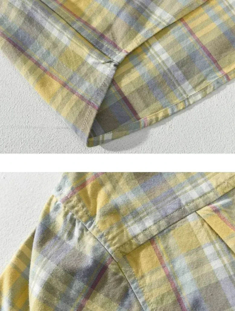 Close-up of yellow and gray plaid pattern on RETRO cotton summer plaid shirt fabric.