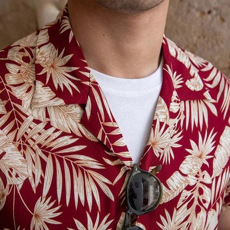 Vintage Hawaiian flower shirt with red and cream floral pattern, perfect for casual summer wear.