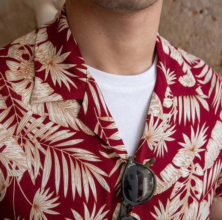 Vintage Hawaiian flower shirt with red and cream floral pattern, perfect for casual summer wear.