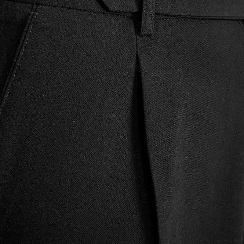 Close-up of Italian straight style elegant pants in black polyester fabric.